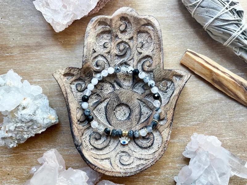 Shop Elegant Jewelry At Unbeatable Prices 6mm Tourmalinated Quartz Beaded Bracelet || White Evil Eye Charm || Reiki Infused Shop Elegant Jewelry At Unbeatable Prices 6mm Tourmalinated Quartz Beaded Bracelet || White Evil Eye Charm || Reiki Infused